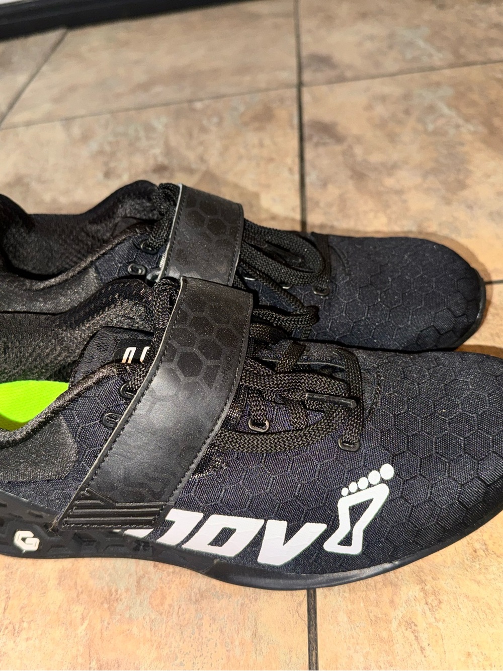 Inov-8 Black Athletic Cross-Training Shoes with White Logo and Neon Green Lining
